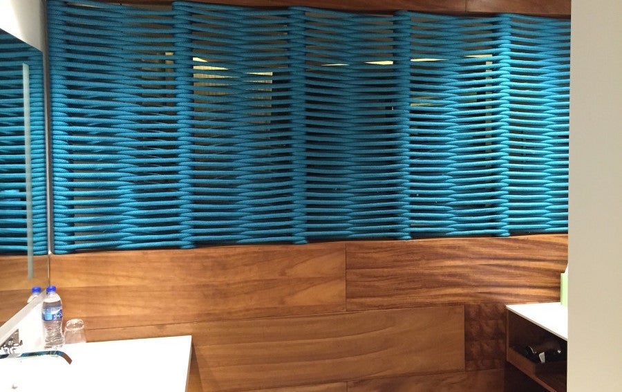 The decor of the room was predominantly white with wood paneling and blue accents.