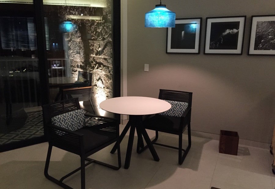 The small table and chairs took up prime floor space but didn't seem logical elsewhere.