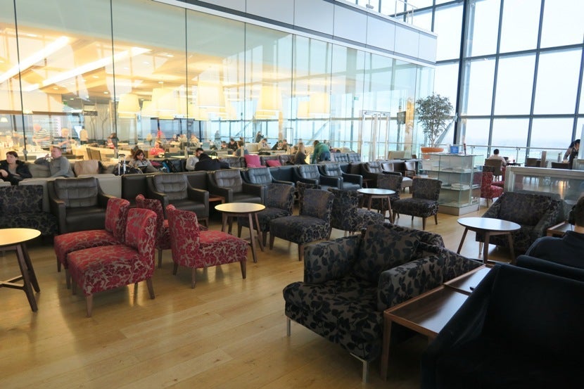 One of the sitting areas in the lounge, with the large glass windows looking out over the runway.