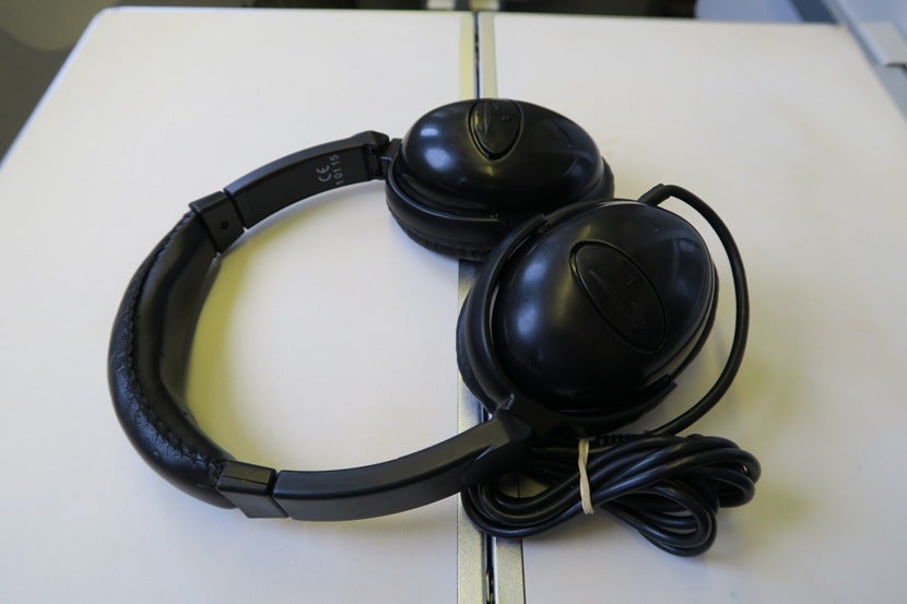 The provided headphones were good enough to block out the cabin noise and provide clear sound.