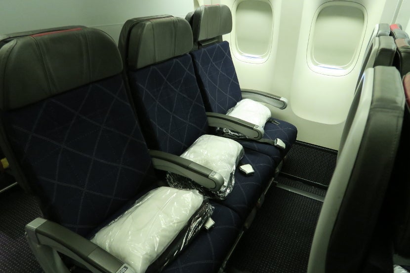 Row 18 is the third and final row in a small Main Cabin Extra cabin.