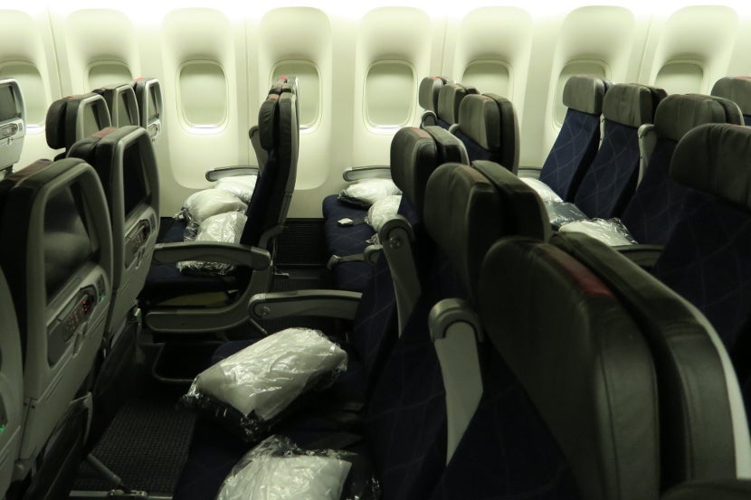 Packaged pillows and blankets were seemingly thrown into the seats before the passengers boarded.