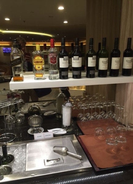 The limited self-serve bar in side the T1 SATS Lounge.