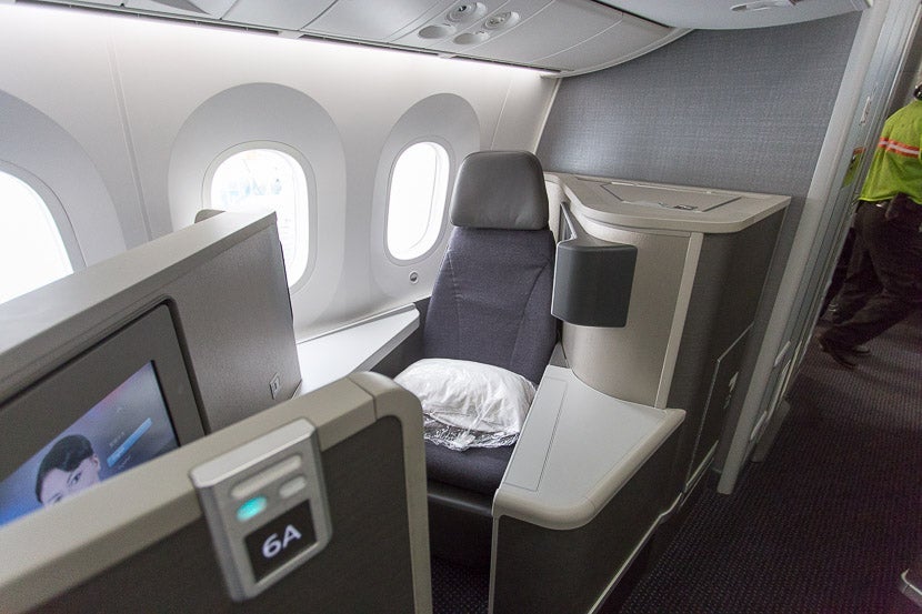 Backward-facing seats, such as 6A, have more personal space with two side tables, but are narrower without the side armrest.