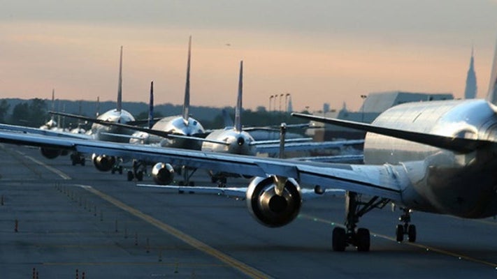 Airplanes-line-on-runway-banner-shutterstock-1826627
