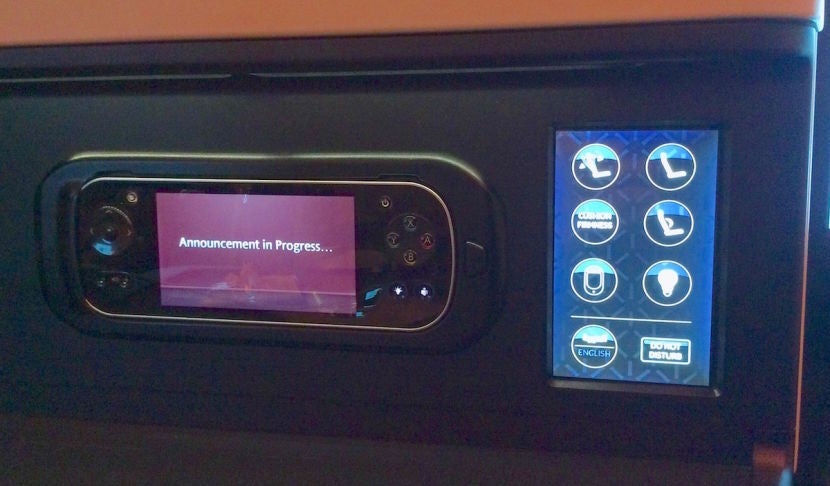 The seat controls and handheld remote for the IFE and lights.