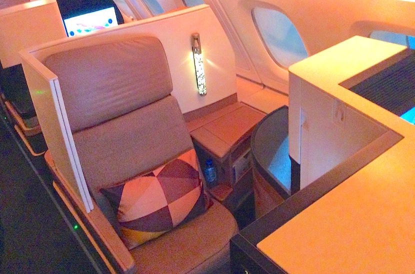 I originally had a rear-facing seat with a narrow aisle armrest.