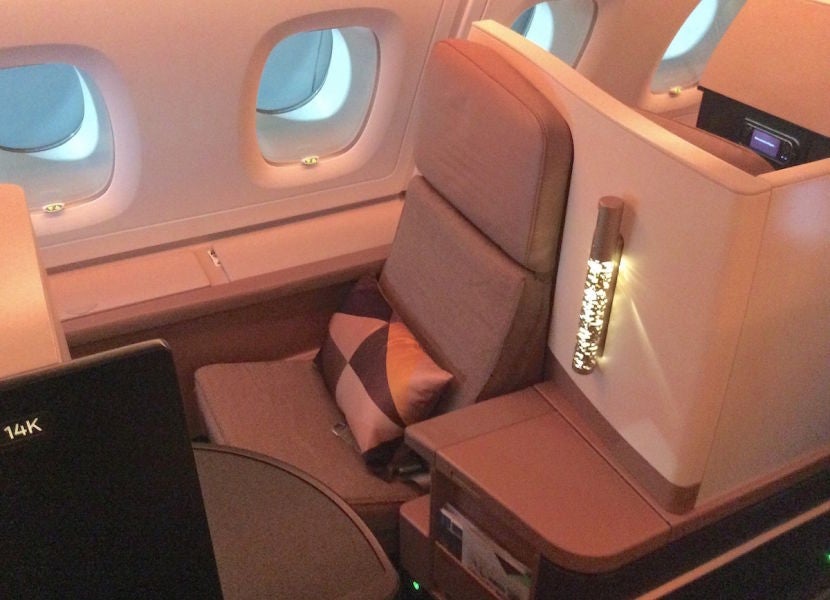 I was able to switch to a front-facing seat with a wider armrest separating it from the aisle.