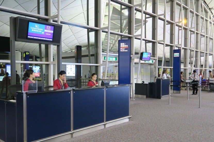 While there were overhead signs for only First/Business and Economy, there was also a middle line for some of Cathay Pacific's lowest-tier elite members.