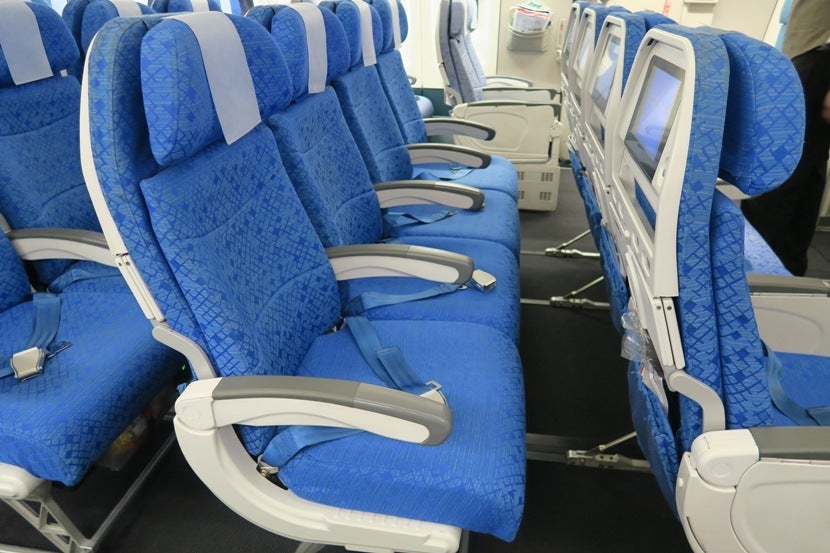 If you happen to be on an empty flight, the four-seat middle rows could turn into a nice "poor man's lay-flat seat."
