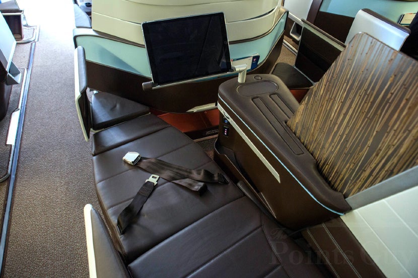 In the full lie-flat position the seat extends out to the fixed ottoman.