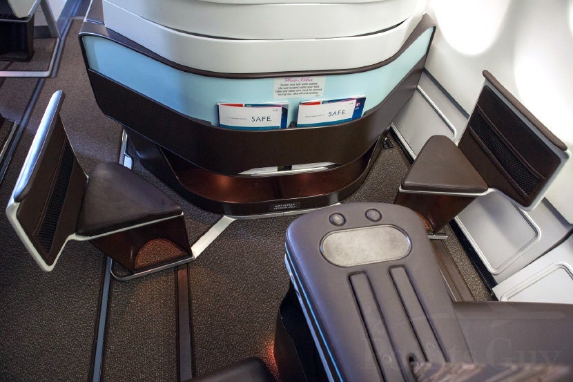 Each seat has a fixed ottoman, so you can put your feet up even before you recline.