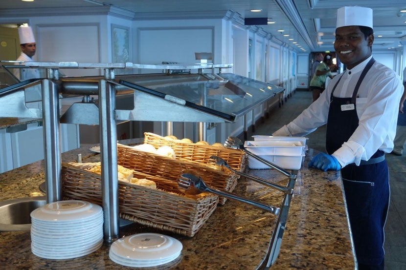 Buffet team member smiling on the Adonia.