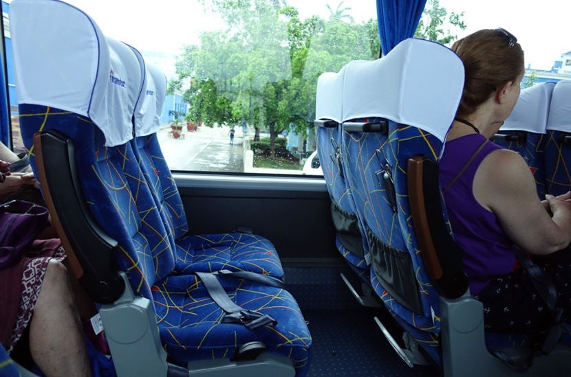 Living the tour bus dream right here with a whole row to myself and plenty of room to spread out — or switch seats if we pass something cool on the opposite side.