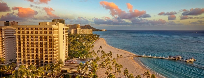 Save on an upcoming stay at Hilton - such as at the Hilton Hawaiian Village in Waikiki. Image courtesy of Hilton.