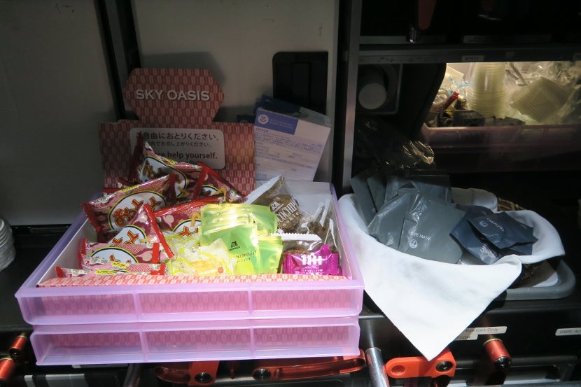 The "Sky Oasis" snack box had plenty of snacks for those who were awake, while the basket next to it had eye masks and ear plugs to aid sleeping.