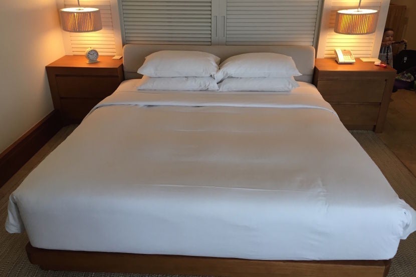 The comfortable king bed faced the sliding glass doors.