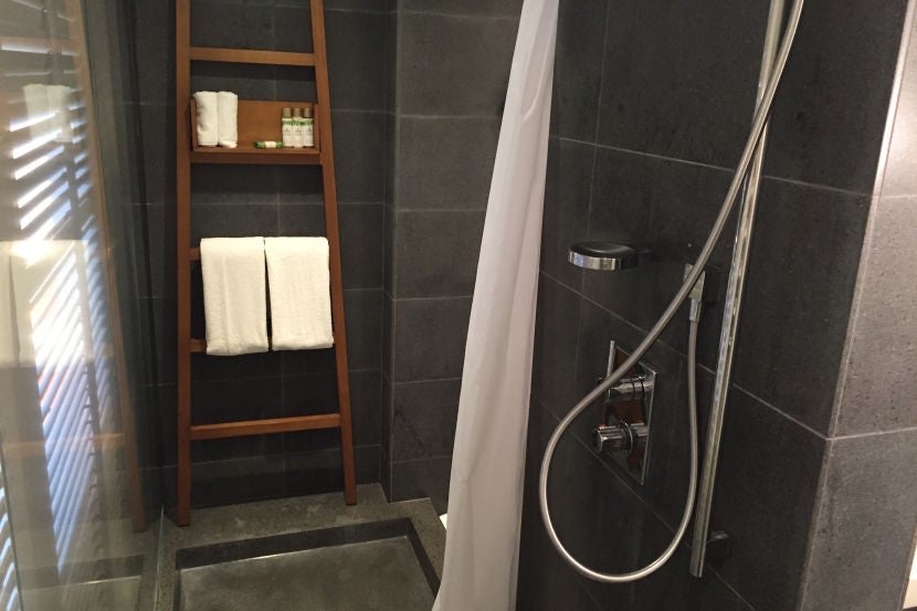 The shower was unnecessarily long and narrow.