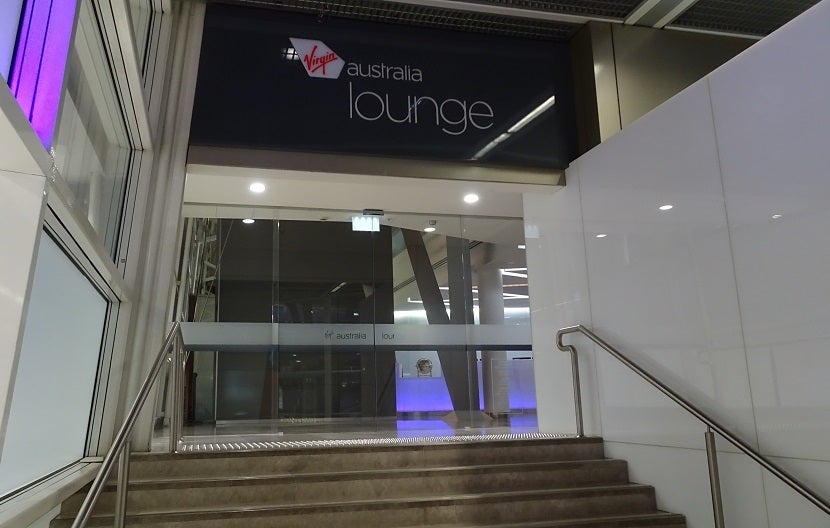At the top of the stairs, the Virgin Australia Lounge awaits.