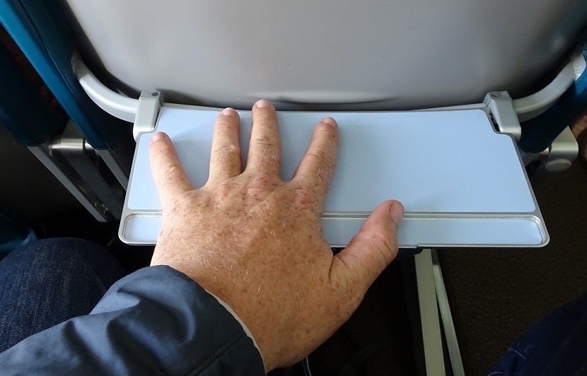 Look like you have giant hands when you use the tiny tray table.