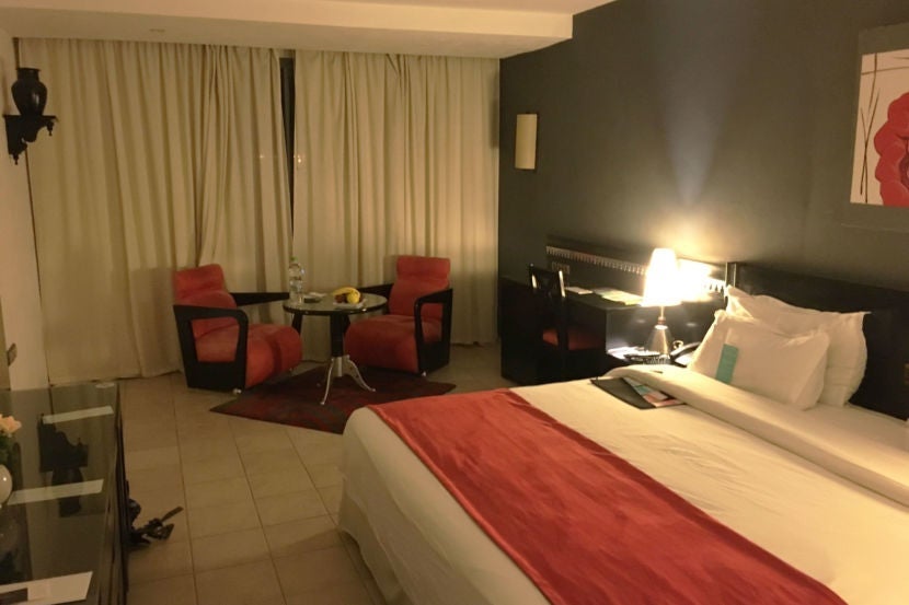 The room had small seating area and large king-sized bed.