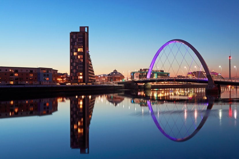 Visit Glasgow, Scotland's largest city. Image courtesy of <a href="http://www.shutterstock.com/pic-151137227/stock-photo-glasgow-scotland-december-24-the-clyde-arc-bridge-reflection-on-december-24-2010-in-glasgow-scotland-the-clyde-arc-bridge-opened-in-18-september-2006.html?src=UROHEHxJfCDNXCQU8Y3X5g-1-12">Shutterstock</a>.