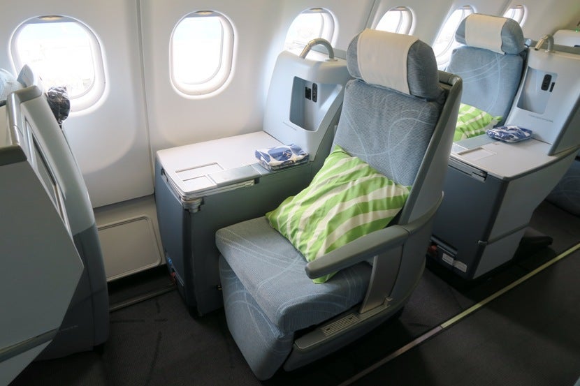 The right side of the business class cabin features staggered one-seat rows.