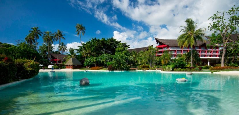 The beautiful pool and lush tropical landscaping at Le Meridien Tahiti