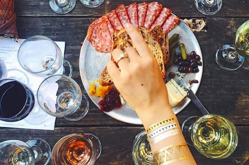Sipping wine at Bacchanal in the Bywater Neighborhood is a lovely way to spend an evening. Image courtesy of Bacchanal's <a href="https://www.facebook.com/bacchanalnola/photos" target="_blank">Facebook page</a>.