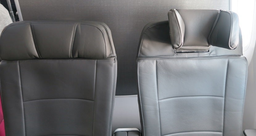 Premium economy headrest arranged at their least and most extended.