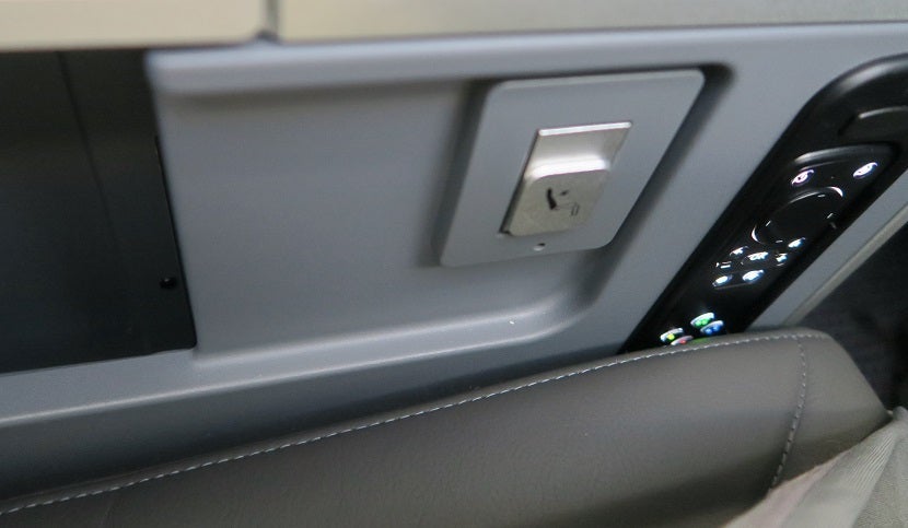 The horrible placement of the premium economy remote.