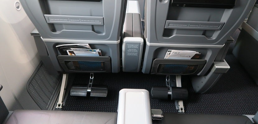 Simple footrest fold out from the seats in front of rows 10 and 11.