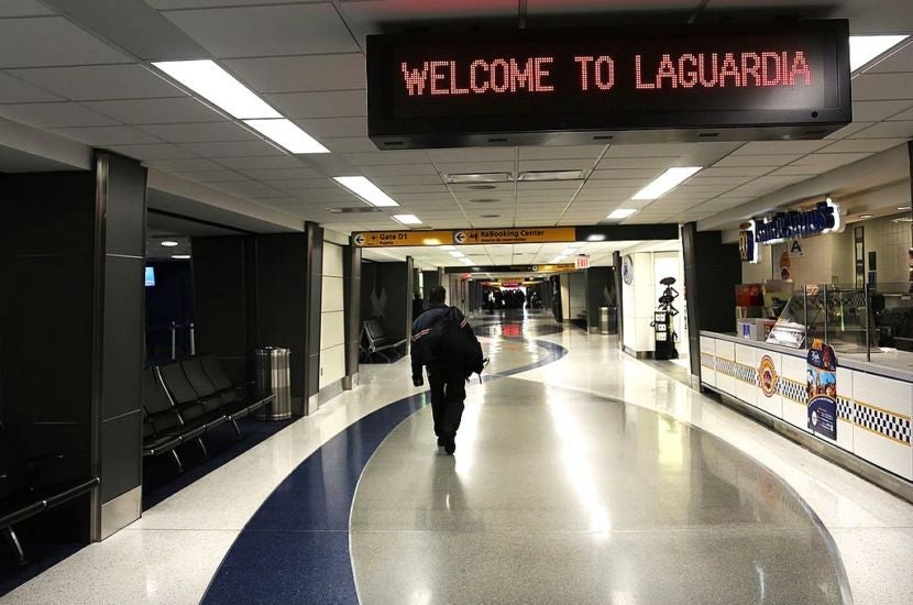 NEW YORK, NY - NOVEMBER 07: A lone person walks through an empty LaGuardia Airport on November 7, 2012 in New York City. The Northeast suffered another storm today as a mix of snow, rain and high winds moved through the area, canceling flights and creating hazardous driving conditions. Six thousand households in the area are still without power for more than nine days following Superstorm Sandy. (Photo by Spencer Platt/Getty Images)