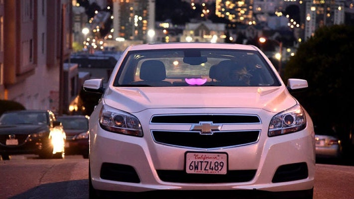 Lyft At Its San Francisco Headquarters Showcasing Lyft Cars, The Glowstache, The Lyft App, Lyft Passengers And Drivers