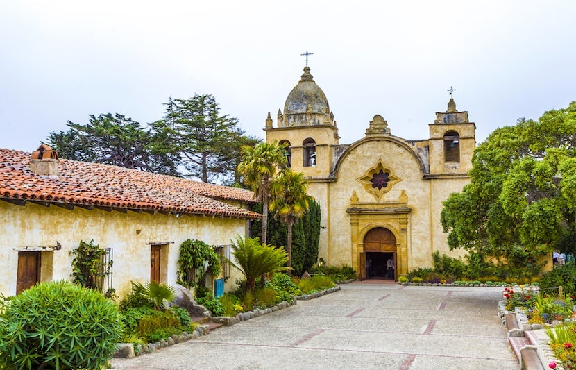 Visit the San Carlos Borromeo de Carmelo Mission for its beauty and its history. Image courtesy of <a href="http://www.shutterstock.com/pic-122850025/stock-photo-carmel-mission-in-northern-california-founded-in-1770.html?src=ulZXq4TrSkZiZufelE3Gnw-1-6">Shutterstock</a>.