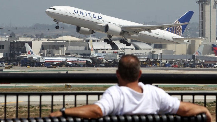united-takeoff-man-on-bench-feat