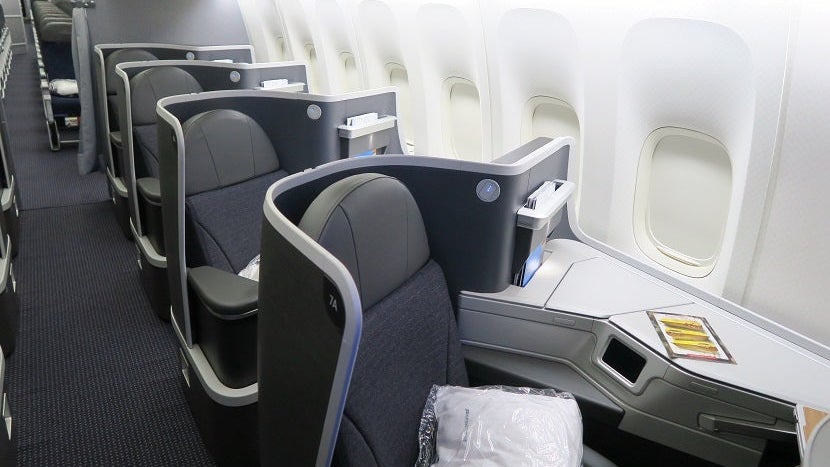 aa-777-200-772-new-retrofit-business-class-window-seats-with-economy-in-background