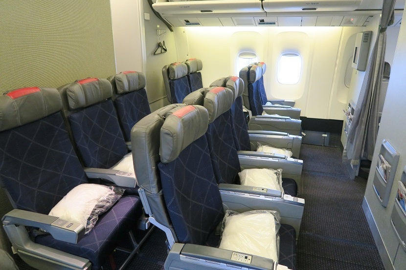 Rows 12 and 13 make up a mini-cabin of Main Cabin Extra seating.