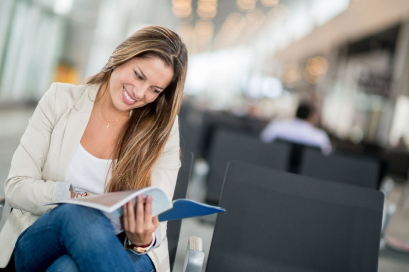 Why not indulge in a little celebrity gossip while waiting for your flight? Image courtesy of andresr via Getty.