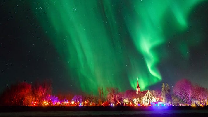 Iceland, Reykjavik, Aurora borealis over church