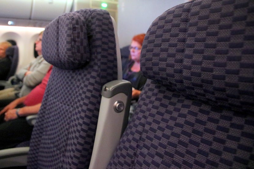 The middle seat in full recline vs. the aisle seat with no recline