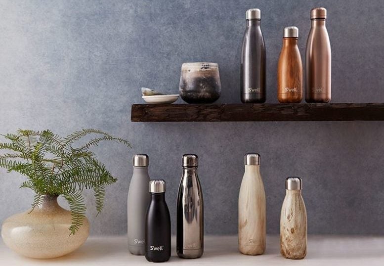 Why not use a reusable bottle, like these S'well ones (that can double as vases at home)? Image courtesy of S'well.