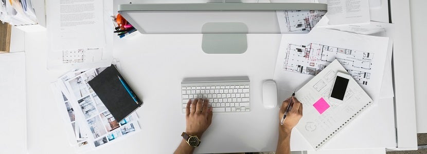 Overhead view architect working at computer