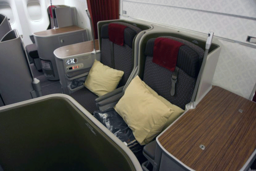 Rows 6 and 7 would be the best business class seats since they are part of a mini-cabin behind first class.