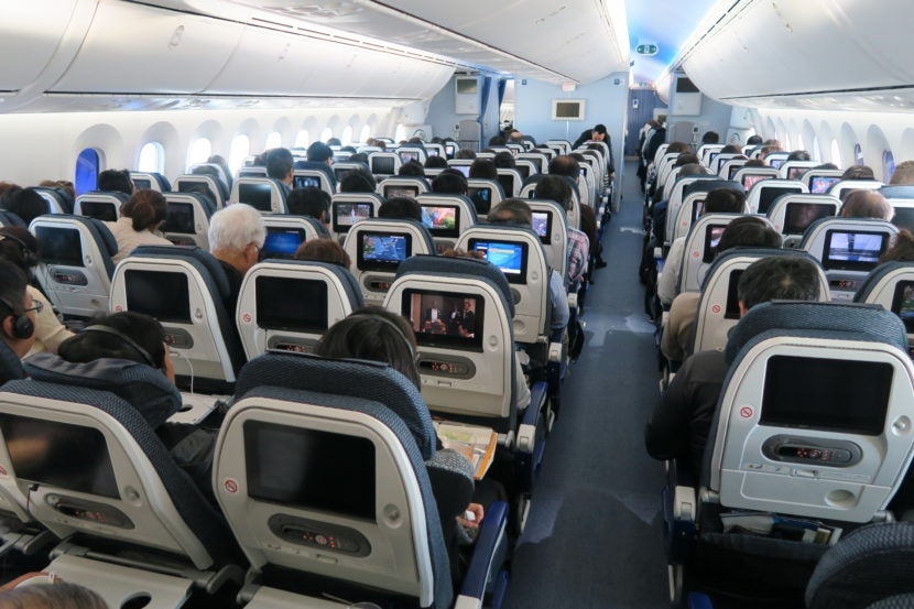 The nine-wide seating arrangement requires narrow seats and narrow aisles.