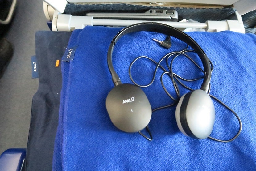Headphones, a blanket and a pillow were available to each economy passenger for the short flight.