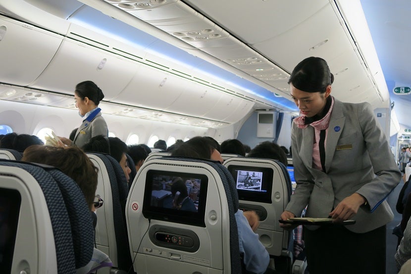 The flight attendants were busy throughout the flight.