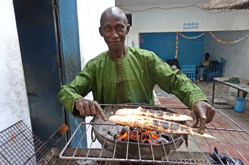 I chatted about boats with this local and then headed over to his restaurant, where he prepared a meal of fresh fish for me. Senegal is a safe and friendly country. Image by the author.