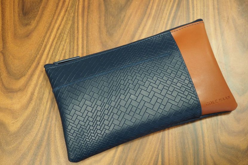 The chic and functional transcon first has an additional outside pocket for your boarding pass and other small items.