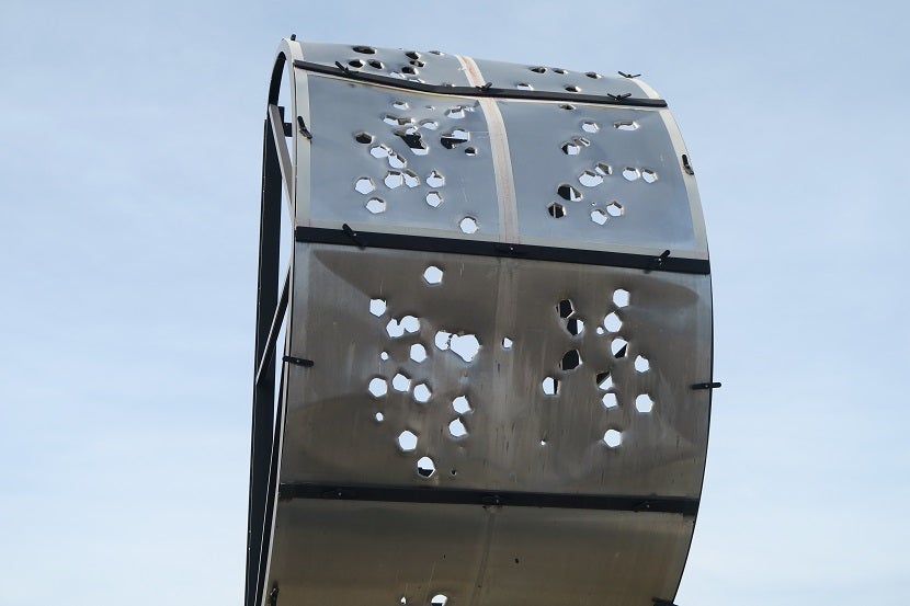 Firefighters train on a test piece of aluminum to help preserve their training aircraft.
